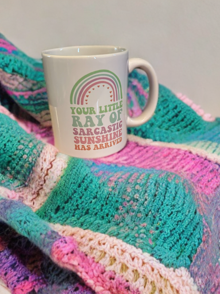 Little_ray_of_sunshine_ mug on blanket